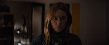 Movie still from “No Limit” (2022), directed by David M. Rosenthal – A person with long brown hair; Close Up shot, Low angle