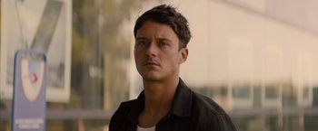 Movie still from “No Limit” (2022), directed by David M. Rosenthal – A person wearing a black shirt; Close Up shot, Low angle