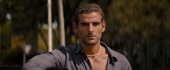 Movie still from “No Limit” (2022), directed by David M. Rosenthal – A person wearing a shirt; Close Up shot, Low angle