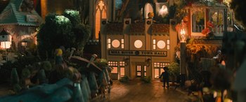 Movie still from “No One Will Save You” (2023), directed by Brian Duffield – A couple of people are standing in front of a building; Extreme Wide shot, High angle