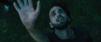 Movie still from “No One Will Save You” (2023), directed by Brian Duffield – A person holding their hand up; Close Up shot, Overhead angle