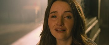 Movie still from “No One Will Save You” (2023), directed by Brian Duffield – A woman's face with smoke coming out of her mouth; Close Up shot, Over the shoulder angle