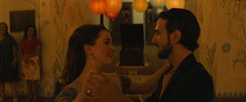 Movie still from “No One Will Save You” (2023), directed by Brian Duffield – A man and a woman dancing in a room; Close Up shot, Over the shoulder angle