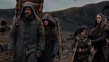 Movie still from “Noah” (2014), directed by Darren Aronofsky – A man and two children in a field; Medium shot, Low angle