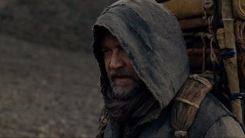 Movie still from “Noah” (2014), directed by Darren Aronofsky – A man with a beard wearing a hooded jacket; Close Up shot, Over the shoulder angle