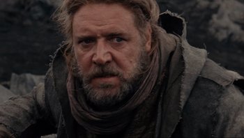 Movie still from “Noah” (2014), directed by Darren Aronofsky – A person with a beard wearing a scarf; Close Up shot, Low angle