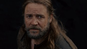 Movie still from “Noah” (2014), directed by Darren Aronofsky – A person with long hair and a beard; Close Up shot, Over the shoulder angle