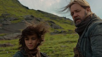 Movie still from “Noah” (2014), directed by Darren Aronofsky – A man and a woman standing next to each other in a field; Close Up shot, Low angle