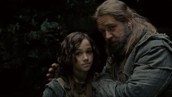 Movie still from “Noah” (2014), directed by Darren Aronofsky – A man and a girl are standing next to each other; Close Up shot, Low angle