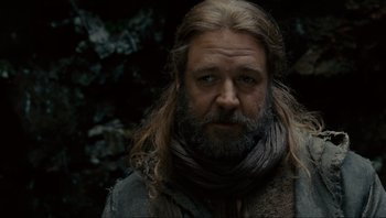 Movie still from “Noah” (2014), directed by Darren Aronofsky – A person with long hair and a beard; Close Up shot, Low angle