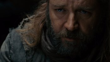 Movie still from “Noah” (2014), directed by Darren Aronofsky – A person with long hair and a beard; Close Up shot, Low angle