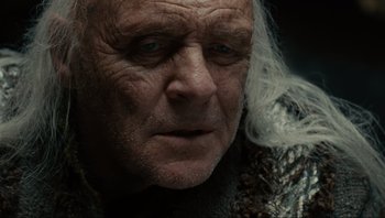 Movie still from “Noah” (2014), directed by Darren Aronofsky – An old man with a long white beard looking at the camera; Close Up shot, Low angle
