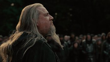 Movie still from “Noah” (2014), directed by Darren Aronofsky – A man with long white hair and a long beard; Close Up shot, Low angle