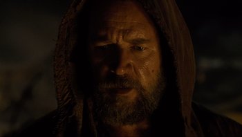 Movie still from “Noah” (2014), directed by Darren Aronofsky – A man with a beard is wearing a hood; Close Up shot, Low angle