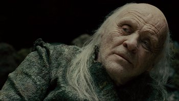 Movie still from “Noah” (2014), directed by Darren Aronofsky – An old man with long white hair looking at the camera; Close Up shot, Low angle