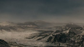 Movie still from “Noah” (2014), directed by Darren Aronofsky – A view of a mountain range in the middle of a valley; Extreme Wide shot, High angle