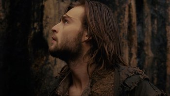 Movie still from “Noah” (2014), directed by Darren Aronofsky – A person with long brown hair; Close Up shot, Low angle