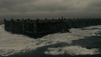 Movie still from “Noah” (2014), directed by Darren Aronofsky – An old wooden pier in the middle of the ocean; Extreme Wide shot, High angle