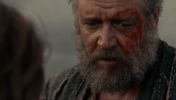 Movie still from “Noah” (2014), directed by Darren Aronofsky – An old man with a beard and a red bandage on his face; Close Up shot, Over the shoulder angle