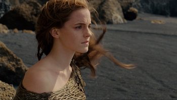 Movie still from “Noah” (2014), directed by Darren Aronofsky – A woman with long brown hair blowing in the wind on a beach; Close Up shot, Low angle