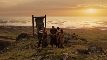 Movie still from “Noah” (2014), directed by Darren Aronofsky – A group of people standing on top of a hill; Wide shot, High angle