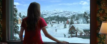 Movie still from “Noelle” (2019), directed by Marc Lawrence – A girl looking out of a window at a ski resort; Medium shot, Over the shoulder angle