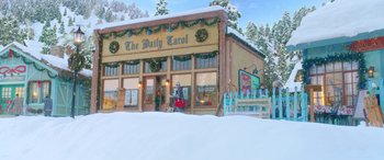 Movie still from “Noelle” (2019), directed by Marc Lawrence – A painting of a store front in the snow; Extreme Wide shot, Low angle