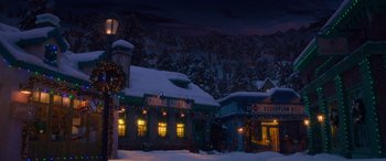 Movie still from “Noelle” (2019), directed by Marc Lawrence – A snowy night scene with a lit up christmas tree; Extreme Wide shot, High angle