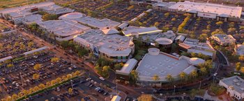 Movie still from “Noelle” (2019), directed by Marc Lawrence – An aerial view of a shopping center in a city; Extreme Wide shot, High angle