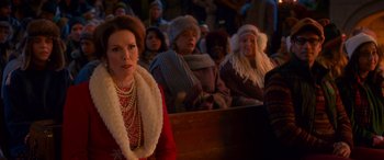 Movie still from “Noelle” (2019), directed by Marc Lawrence – A group of people sitting in front of each other; Medium shot, Over the shoulder angle