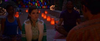 Movie still from “Noelle” (2019), directed by Marc Lawrence – A woman sitting on the ground next to a man; Medium shot, Over the shoulder angle