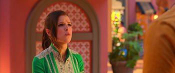 Movie still from “Noelle” (2019), directed by Marc Lawrence – A woman in a green shirt is standing outside; Close Up shot, Over the shoulder angle