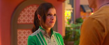 Movie still from “Noelle” (2019), directed by Marc Lawrence – A woman in a green shirt is looking to her left; Close Up shot, Over the shoulder angle