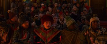 Movie still from “Noelle” (2019), directed by Marc Lawrence – A group of people sitting in front of each other; Medium shot, High angle