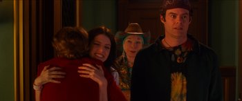 Movie still from “Noelle” (2019), directed by Marc Lawrence – A group of people that are standing up together; Medium shot, Over the shoulder angle