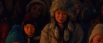 Movie still from “Noelle” (2019), directed by Marc Lawrence – A group of people wearing furry hats and coats; Close Up shot, High angle