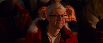 Movie still from “Noelle” (2019), directed by Marc Lawrence – A man in a red coat with a white beard; Close Up shot, Over the shoulder angle
