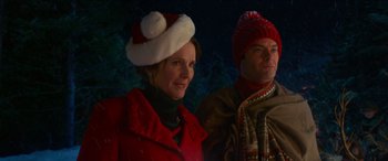 Movie still from “Noelle” (2019), directed by Marc Lawrence – A woman and a man wearing hats and coats; Close Up shot, Over the shoulder angle