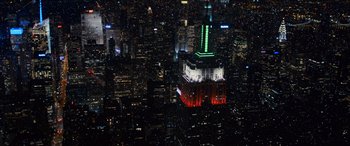 Movie still from “Noelle” (2019), directed by Marc Lawrence – A view of the empire state building lit up at night; Extreme Wide shot, High angle