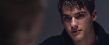 Movie still from “Notorious Nick” (2021), directed by Aaron Leong – A man's face in the dark; Close Up shot, Over the shoulder angle