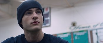 Movie still from “Notorious Nick” (2021), directed by Aaron Leong – A person wearing a hat; Close Up shot, Low angle