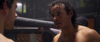 Movie still from “Notorious Nick” (2021), directed by Aaron Leong – A person in a boxing ring; Close Up shot, Low angle