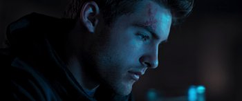 Movie still from “Notorious Nick” (2021), directed by Aaron Leong – A person with a bruise on his face; Close Up shot, Low angle