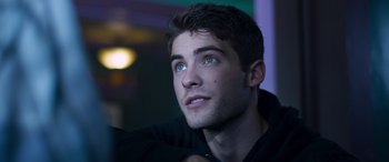 Movie still from “Notorious Nick” (2021), directed by Aaron Leong – A person looking up at something; Close Up shot, Over the shoulder angle