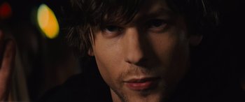 Movie still from “Now You See Me” (2013), directed by Louis Leterrier – A man's face in the dark; Close Up shot, Over the shoulder angle
