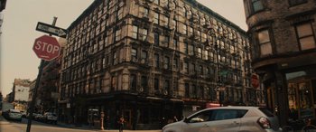 Movie still from “Now You See Me” (2013), directed by Louis Leterrier – An old building in the middle of a city street; Extreme Wide shot, Low angle