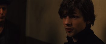 Movie still from “Now You See Me” (2013), directed by Louis Leterrier – A person wearing a black shirt; Close Up shot, Over the shoulder angle