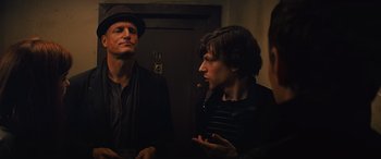 Movie still from “Now You See Me” (2013), directed by Louis Leterrier – Two men standing next to each other in front of a door; Medium shot, Over the shoulder angle