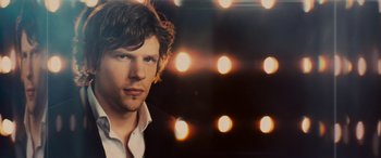 Movie still from “Now You See Me” (2013), directed by Louis Leterrier – A person wearing a white shirt; Close Up shot, Over the shoulder angle