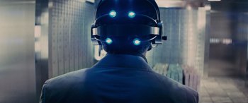 Movie still from “Now You See Me” (2013), directed by Louis Leterrier – A person wearing a helmet with lights on it; Close Up shot, Overhead angle